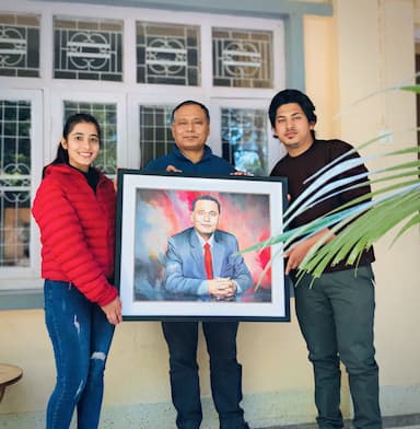 Kul Man Ghising holding portrait