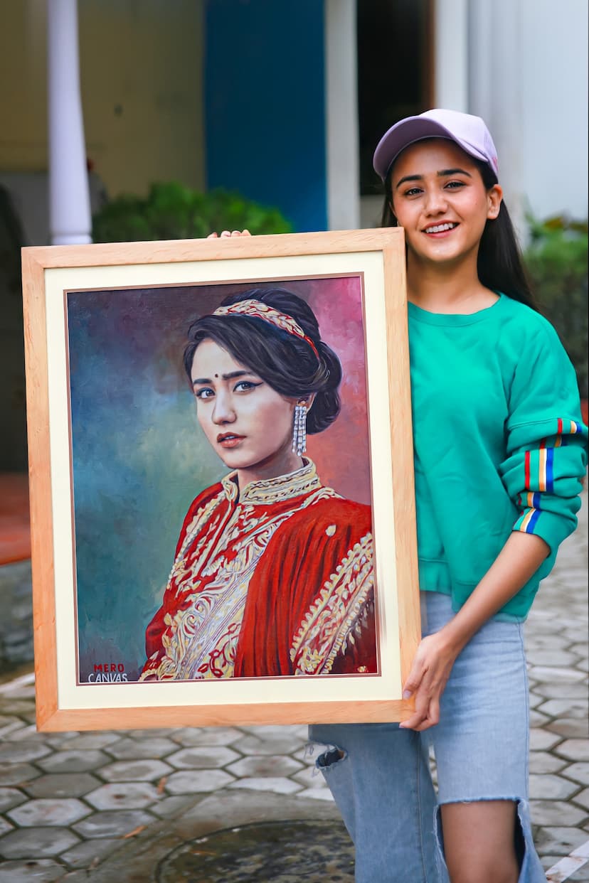 Swastima Khadka holding portrait